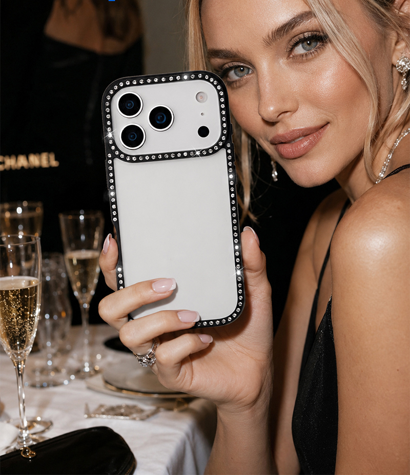 Black rhinestone phone case held at dinner
