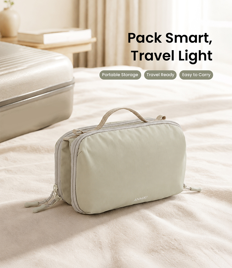 Portable organizer pouch on bed with luggage