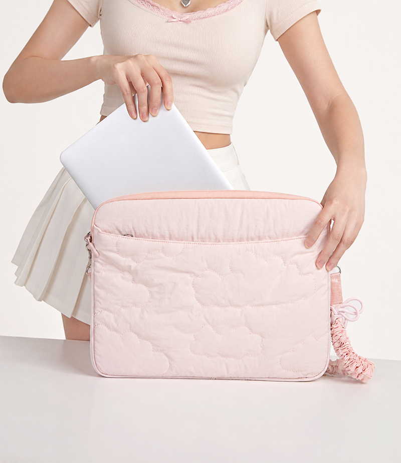 Cloud puffer laptop bag lifestyle carrying